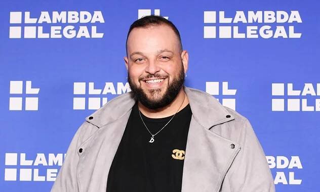 Mean Girls star Daniel Franzese in a black shirt and grey jacket