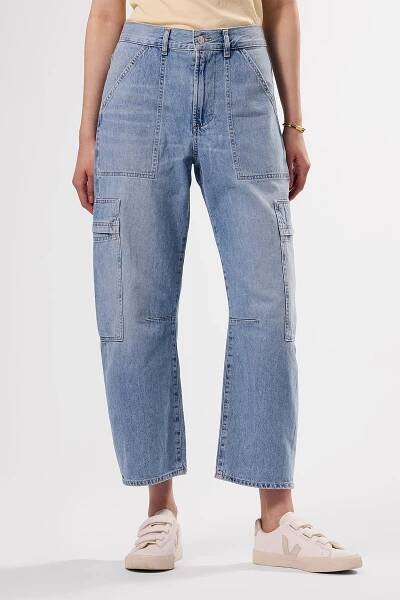 A person wearing Citizens of Humanity Marcelle Low Slung Easy Cargo Pant in blue denim
