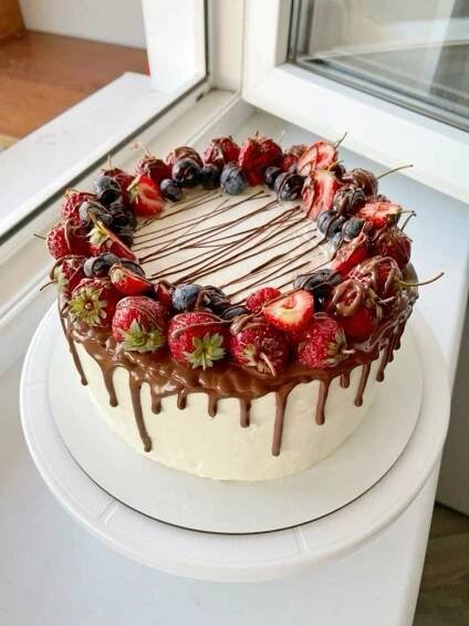 a cake with chocolate icing and strawberries on top