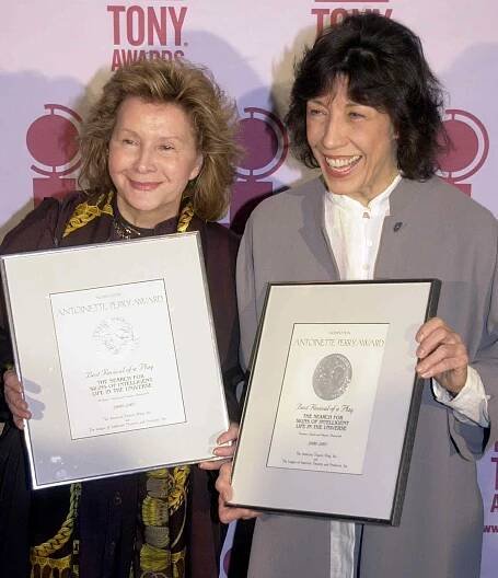 Lily Tomlin (R) and Jane Wagner (L) hold up the Tony Award nominations they earned as producers of "The Search for Signs of Intelligent Life in the Universe," a play which was nominated for Best Revival of a Play, during a nominees brunch in New York 16 May, 2001