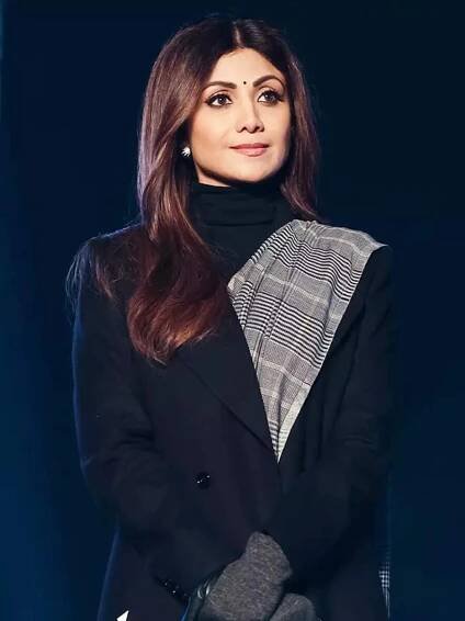 Shilpa Shetty sets winter fashion goals in a saree with a trench coat and gloves
