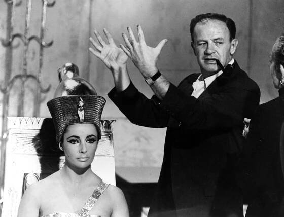 23rd October 1961: American director Joseph L Mankiewicz discusses Elizabeth Taylor's Egyptian-style headdress with costume designer Irene Sharaff, on the set of the 20th Century Fox epic 'Cleopatra'. 