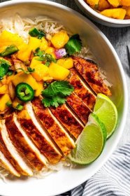 Mango chicken is made of chicken marinated in a sweet, smokey, citrusy sauce, cooked in a hot pan, and served with a sweet, spicy mango salsa.