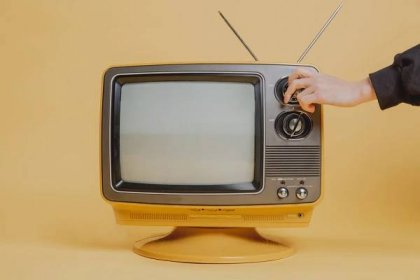 tuning a vintage television set