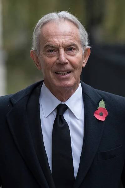 Sir Tony Blair wearing a poppy.