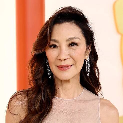 Michelle Yeoh Looks Heavenly In A White Fringe Dior Gown on the 2023 Oscars Red Carpet
