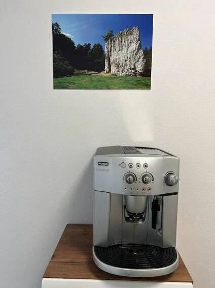 a coffee maker sitting on top of a wooden table at Apartmány Nová duha Vavřinec in Vavřinec