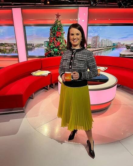 Nina Warhurst on the BBC Breakfast set holding a mug.
