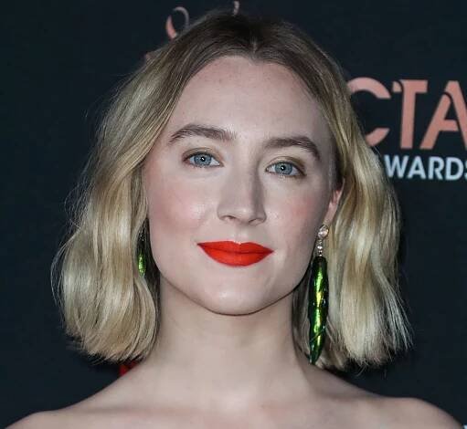 Saoirse Ronan stuns in Jacquie Aiche pave diamond opal and beetle wing earrings, adding a bold, nature-inspired touch to her elegant red carpet look