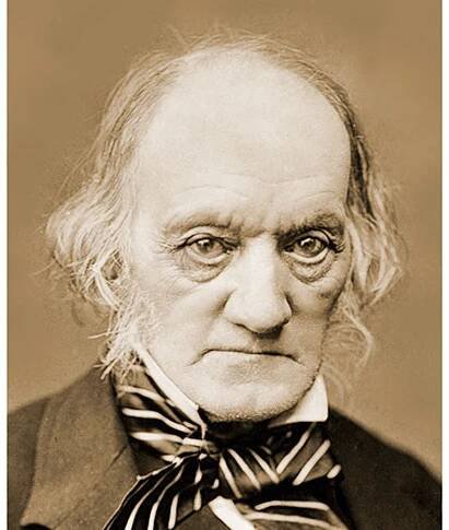 A photograph of Richard Owen in a suit with a striped tie.