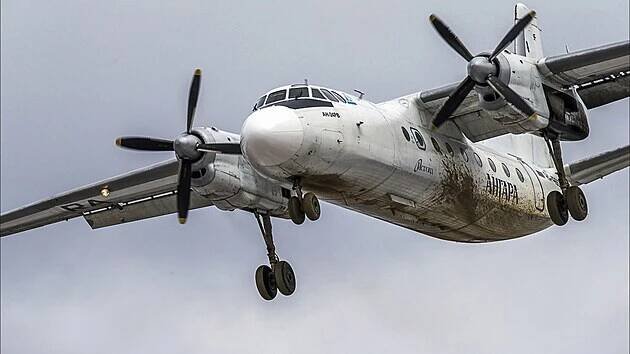 This photo taken in Sunday, April 13, 2014, shows a Russian An-24 passenger plane of the Siberia-based Angara Airlines, the same aircraft brand that crashed while carrying multiple passengers has been found in the country's Far Eastern Amur region, flying over an airport outside Irkutsk, Russia. (AP Photo/Marina Lystseva)