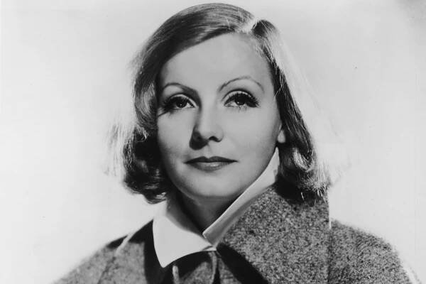 circa 1935: Studio portrait of Swedish actor Greta Garbo (1905 - 1990) wearing a blouse and a tweed cape with a wide collar. (Photo by Hulton Archive/Getty Images)
