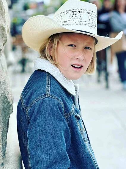 Steely Rose Hauser posing in a cowboy hat