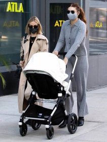Gigi Hadid goes braless in Public Habit cashmere cardigan and wide-leg pants in New York City on March 29, 2021