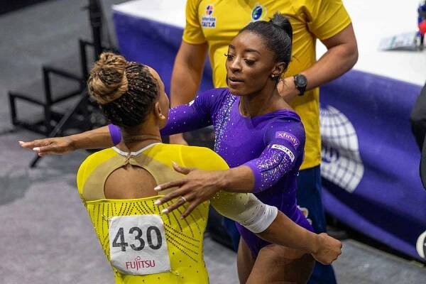 Simone Biles of the United Sates and Rebeca Andrade of Brazil embrace after the Women's Floor Final at the Artistic Gymnastics World Championships-Antwerp 2023