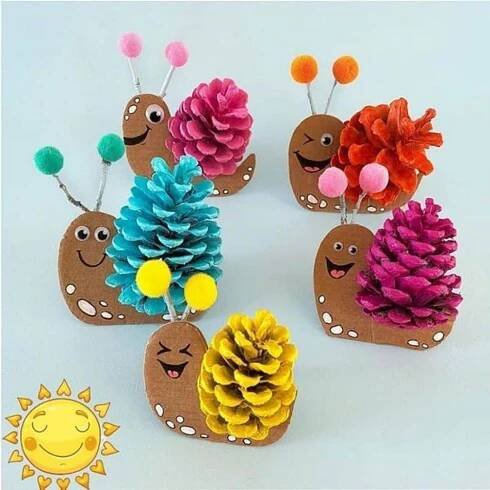 four paper crafts made to look like pine cones