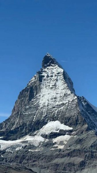 Free A breathtaking shot of the Matterhorn mountain in Zermatt, Switzerland against a clear blue sky. Stock Photo