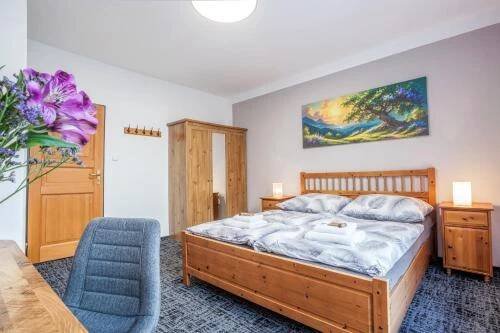 Postel nebo postele na pokoji v ubytování Pension U Lípy