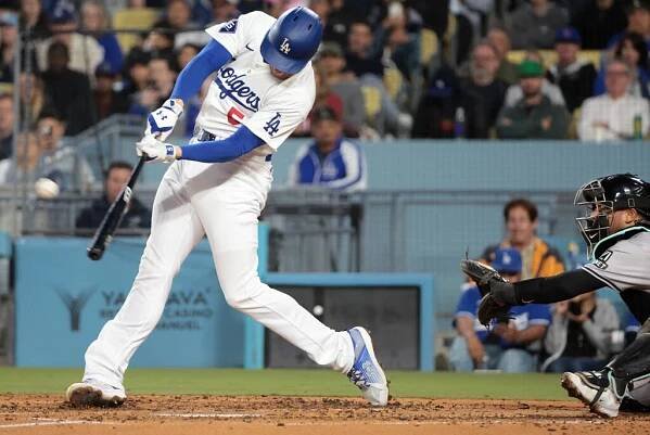 LOS ANGELES, CALIFORNIA May 20, 2024- Dodgers Freddie Freeman hits a grand slam against the Diamondbacks in the third inning at Dodgers Stadium Monday. (Wally Skalij/Los Angeles Times)