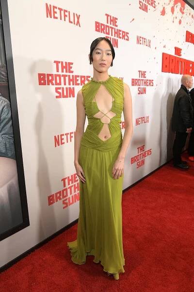 Madison Hu attends Netflix's 'The Brothers Sun' Los Angeles Premiere wearing a long green dress