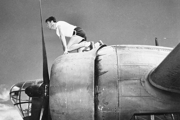 Louis Zamperini Perched on B-18 Bomber