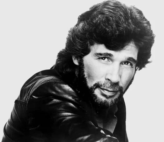 Who Won Acclaim Writing Songs for Elvis and Ronnie Milsap Before Charting a Hit of His Own? 