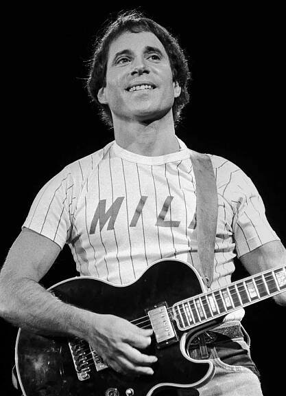 Paul Simon plays guitar during a 1980 concert at the Meadowlands in East Rutherford, New Jersey
