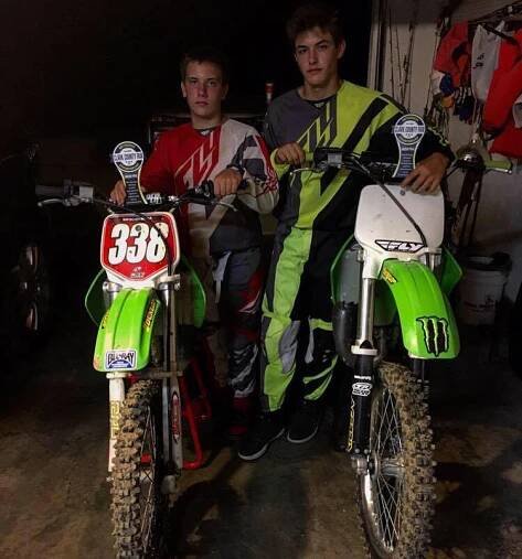 Griffin Johnson with Graham Johnson on Dirt Bike