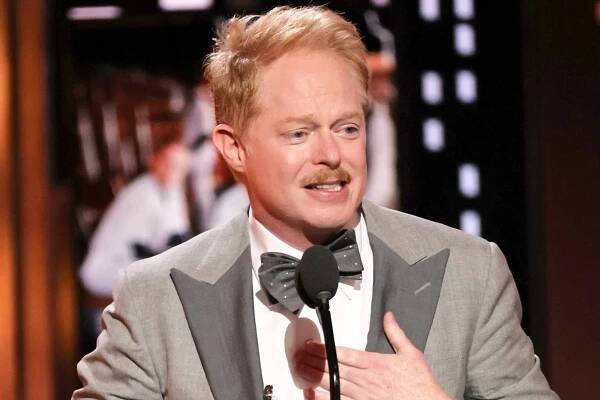 Jesse Tyler Ferguson accepts the award for Best Performance by an Actor in a Featured Role in a Play for "Take Me Out" onstage at the 75th Annual Tony Awards at Radio City Music Hall on June 12, 2022 in New York City.