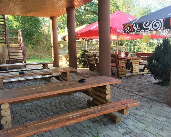  Seating area outside with view of fenced in goat yard