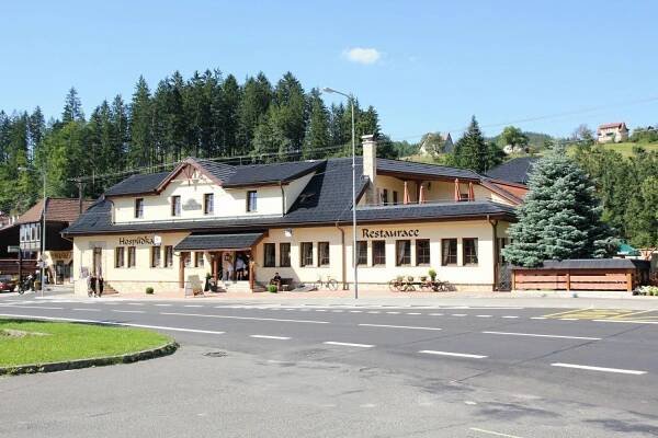 a building on the side of a street at Penzion a restaurace Staré Časy in Horní Bečva