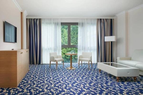 Postel nebo postele na pokoji v ubytování Grandhotel Nabokov