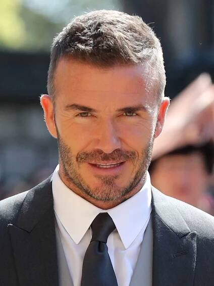 David Beckham arrives at St George's Chapel at Windsor Castle before the wedding of Prince Harry to Meghan Markle on May 19, 2018 in Windsor, England