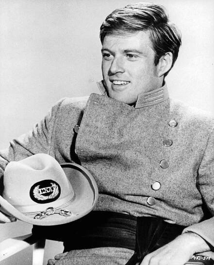 Robert Redford Sitting With A Hat On His Lap In A Scene From The 1965 Movie 'Inside Daisy Clover'.