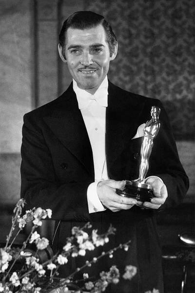 Clark Gable holds his Best Actor Oscar during the seventh annual Academy Awards at the Biltmore Bowl in L.A. on Feb. 27, 1935.