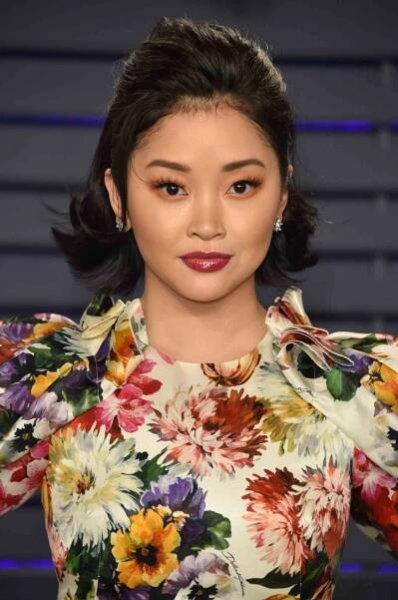 Lana Condor with a half-up, half-down hairstyle, a short wavy hair look