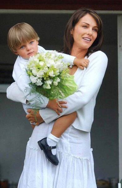 Elizabeth Hurley with son Damian arriving to open the Ampney Crusis Fete. 