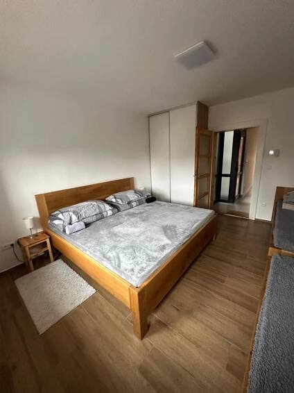 a bedroom with a large bed in a room at Vila Kosmonautka - Velké Losiny in Velké Losiny