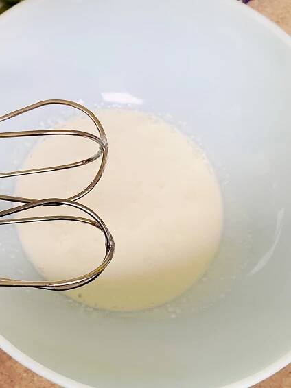 heavy cream in bowl ready to whip with mixer - updated