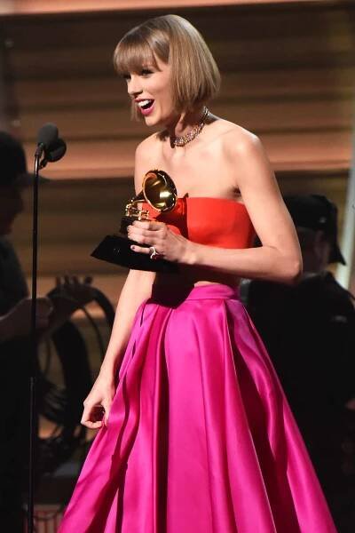 Taylor Swift accepts the Album of the Year award for "1989" onstage during The 58th GRAMMY