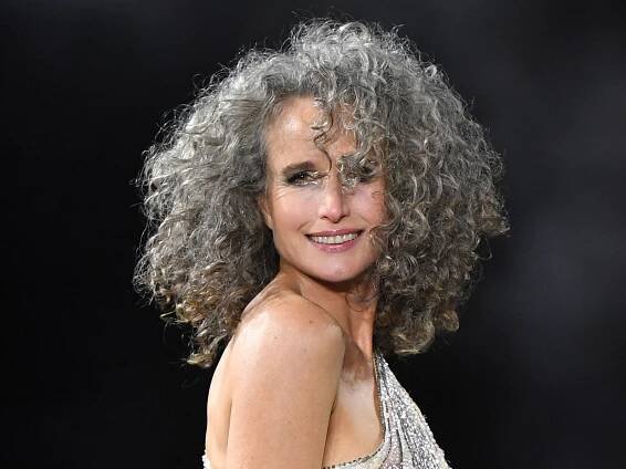 Andie MacDowell’s Natural Gray Curls Shine on the Runway in Paris