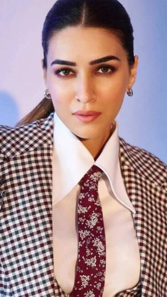 Kriti Sanon aces power dressing ina black gingham three-piece suit with a burgundy tie