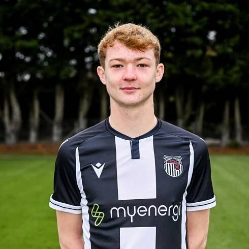 Portrait of a young man in a Grimsby Town FC soccer jersey.