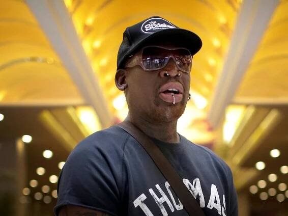 Watch Dennis Rodman arrive in Singapore ahead of the Trump-Kim summit