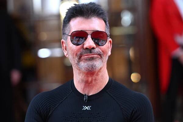 X Factor legend breaks down as 'nervous' Simon Cowell walks her down aisle