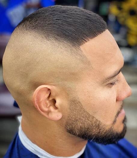 Fade with a Sleek Combed-Forward Top