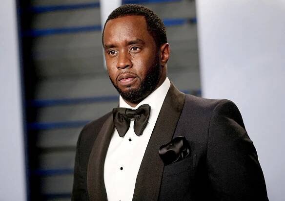 A man in a black tuxedo.