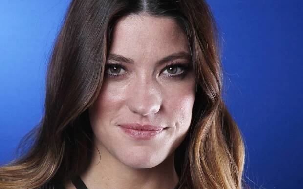 Jennifer Carpenter gleaming with a radiant smile Wallpaper