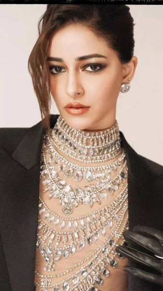 Ananya Panday stuns in a dramatic black gown with a cape blazer and a bedazzled bodysuit