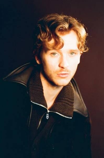 Image may contain Face Head Person Photography Portrait Clothing Coat Jacket Adult Blonde and Hair